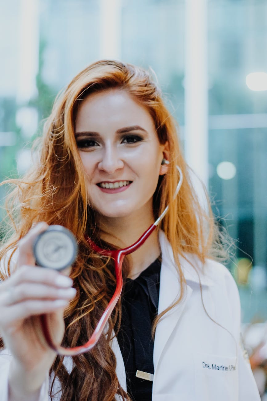 photo of woman wearing stethoscope